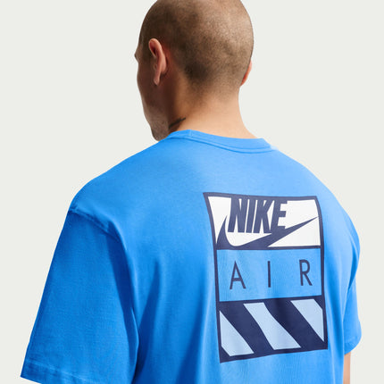 Close-up back view of a light photo blue Nike t-shirt featuring a dark blue and white Nike Air square graphic print.
