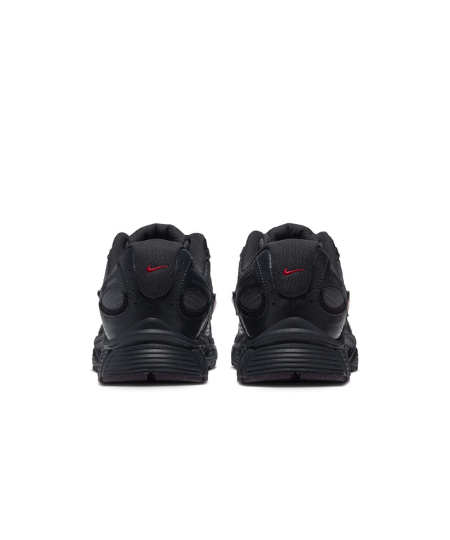 Rear view of Nike V5 RNR sneakers in iron grey ripstop fabric featuring tough red mini swooshes on the heel tabs.
