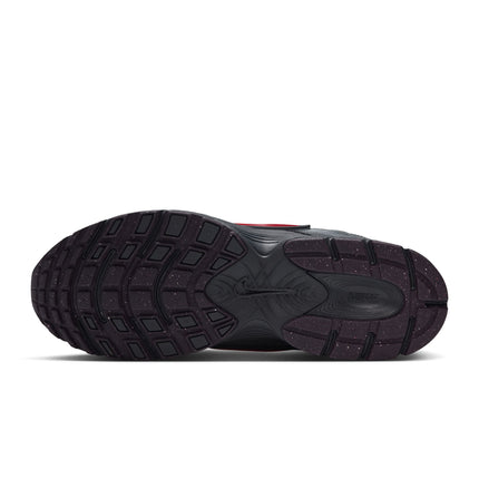 Bottom view of a Nike V5 RNR sneaker featuring a dark grey rubber outsole with red specks and a molded Nike logo.