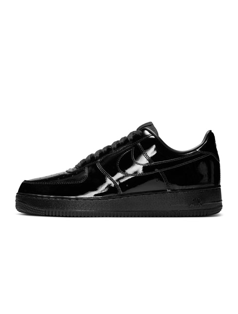 Nike Air Force 1 '07 men's sneaker in all black with a shiny patent leather finish, shown from a side profile view.