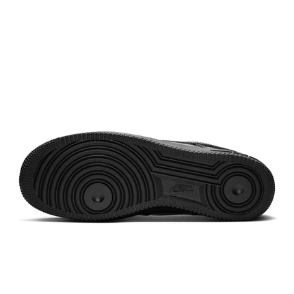 Black Nike Air Force 1 07 sneaker outsole featuring a textured rubber grip pattern and a centered Nike brand logo.