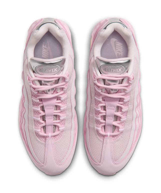 Top view of Nike Womens Air Max 95 Big Bubble sneakers in light pink foam with shiny metallic chrome tongue detailing.