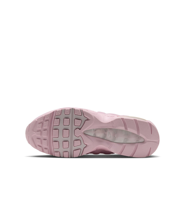 Bottom view of a pink Nike Women's Air Max 95 sneaker, featuring a textured rubber outsole and visible heel cushioning.
