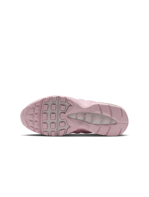 Bottom view of a pink Nike Women's Air Max 95 sneaker, featuring a textured rubber outsole and visible heel cushioning.