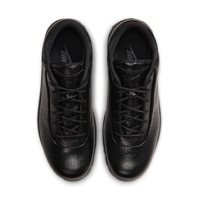 A pair of black Nike sneakers with a textured leather finish, shown from a top-down view on a white background.