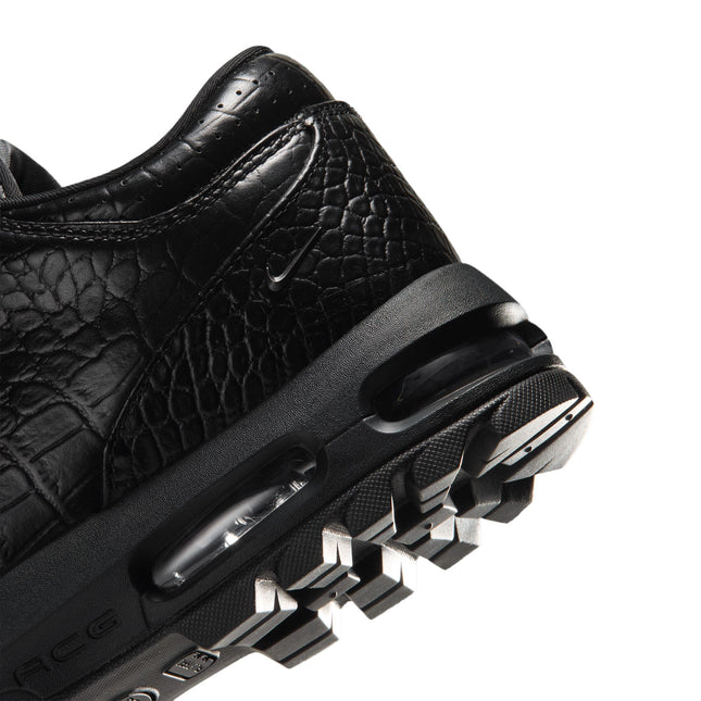 Black Nike Air Max Goadome Low sneaker heel featuring crocodile-textured leather, visible air cushioning, and lug sole.