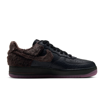 Nike Air Force 1 Low sneaker featuring black pebbled leather with brown faux fur paneling and a dark translucent sole.