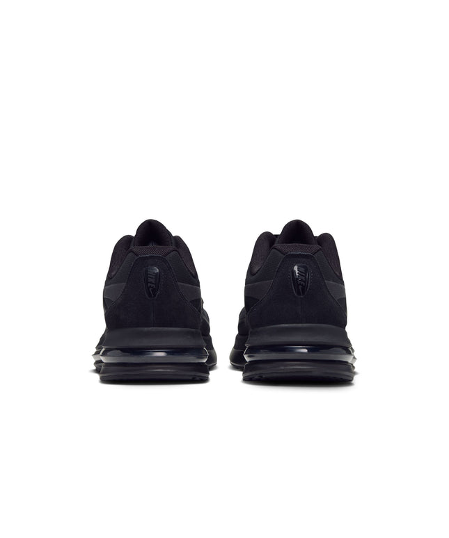 Rear view of Nike Air Max Metro sneakers featuring an all-black colorway with suede accents and a visible air unit.