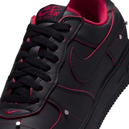 Nike Air Force 1 low-top sneaker in black leather with gym red piping, metallic silver studs, and red interior lining.