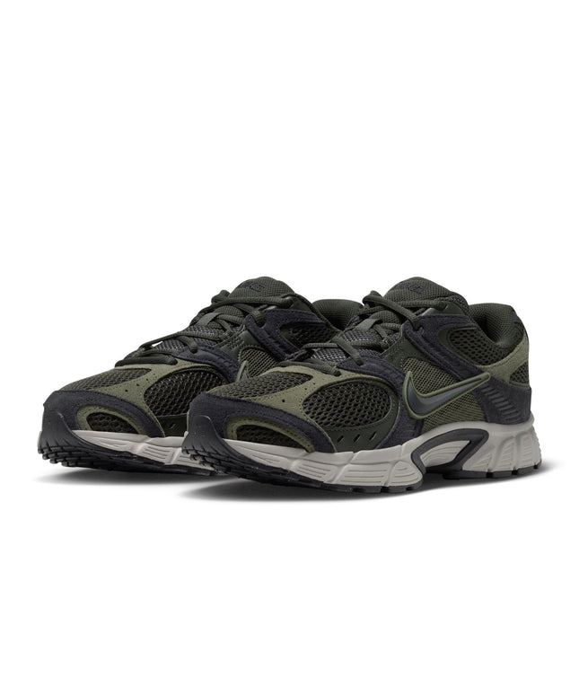 Nike V5 RNR running shoes in olive green and black suede and mesh with a grey midsole, shown in a side profile view.