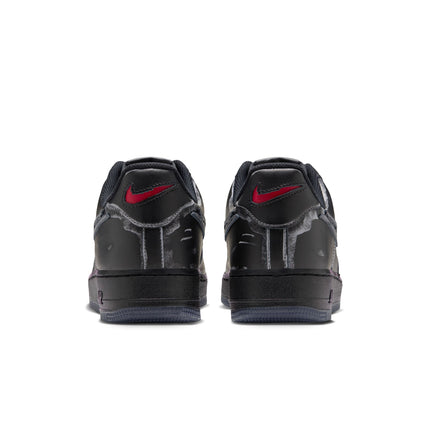 Back view of black leather Nike Air Force 1 '07 Scream sneakers featuring frayed fabric accents and red swoosh logos.