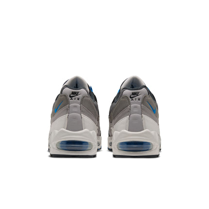 Rear view of Nike Air Max 95 sneakers in anthracite and light graphite suede with blue spark accents and air bubbles.