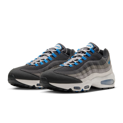 Nike Air Max 95 sneakers in anthracite, grey, and blue, featuring mesh and suede layering with a white foam midsole.