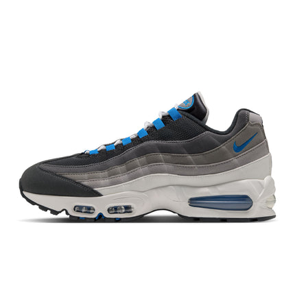 Nike Air Max 95 sneaker featuring a grey and black gradient upper with vibrant blue spark accents and a white midsole.