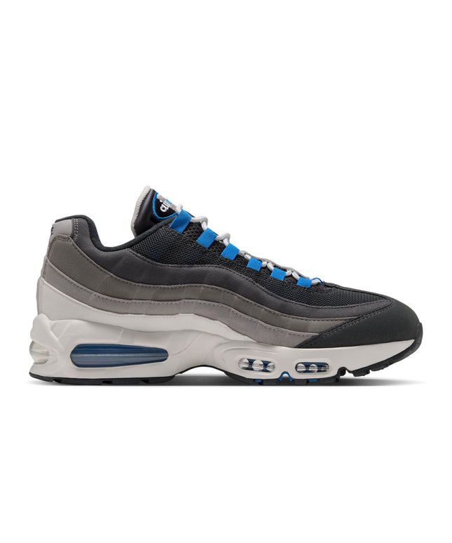 Nike Air Max 95 sneaker in anthracite mesh and graphite suede with bright blue spark lacing and blue sole air units.