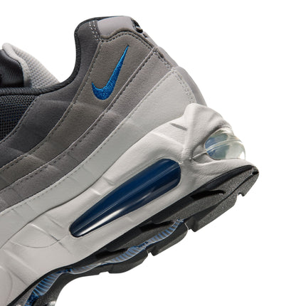 Close-up of a grey and anthracite Nike Air Max 95 sneaker featuring a blue embroidered swoosh and blue air bubble unit.