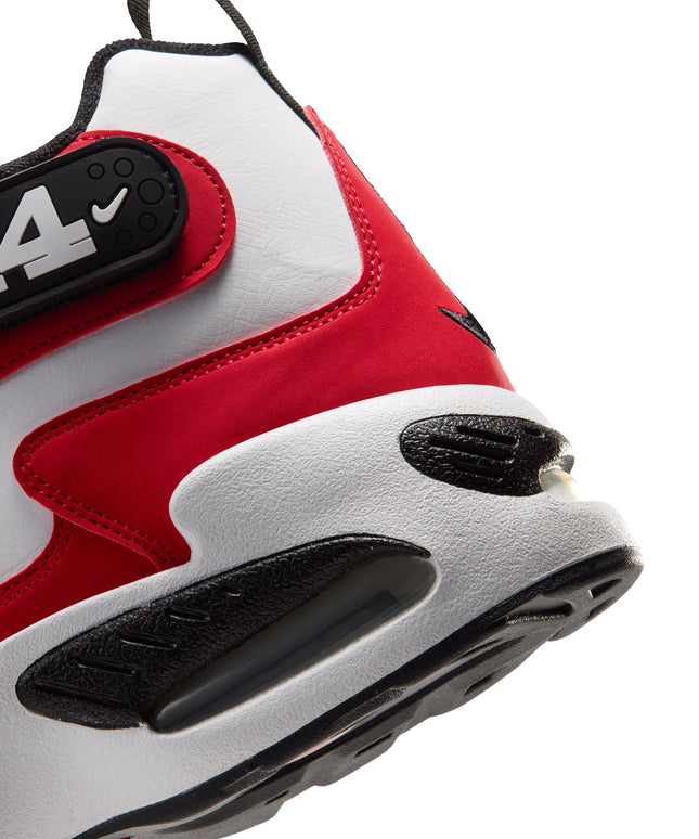 Close-up of a white and red Nike Air Griffey Max 1 featuring a leather upper, black 24 strap, and visible Air sole unit.