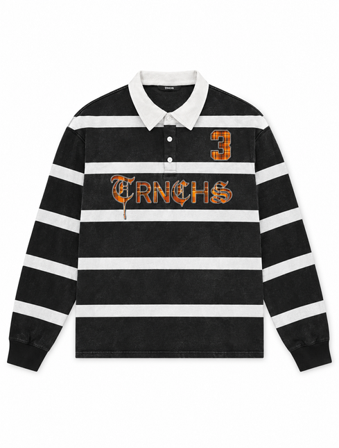 Trnchs black and white striped long-sleeve polo with a vintage wash, orange plaid text logo, and number 3 applique.
