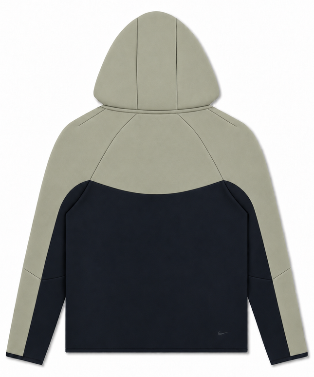 Back view of a Nike Men's Tech Fleece full-zip hooded jacket featuring a two-tone light army and dark navy colorway.