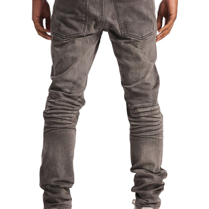 Embellish David skinny jeans in dark indigo denim with a vintage washed finish and stacked leg detail from behind.