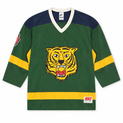 Nike Sportswear Club hockey jersey in fir green featuring a front tiger graphic, yellow stripe accents, and navy shoulders.