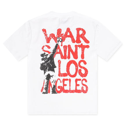 A white short-sleeve t-shirt with a distressed graphic print on the front. The graphic features the text 'WAR SAINT LOS ANGELES' in a bold red font, overlaid with a black silhouette of a figure holding a sword.