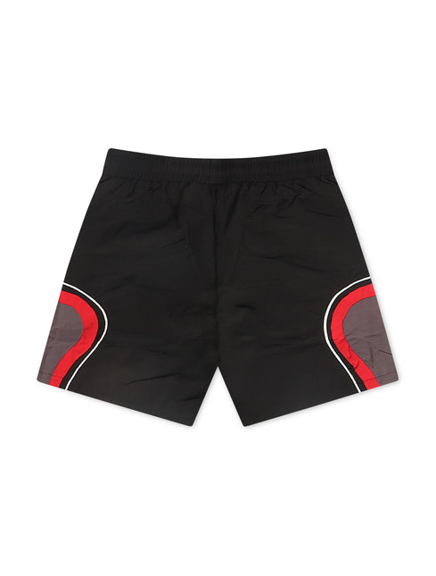 Syndicate black nylon shorts featuring a distinct red and grey curved accent panel on each side leg for a sporty look.