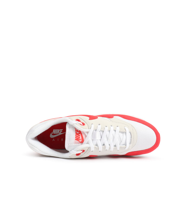 Top view of a Nike Women's Air Max 1 '86 OG sneaker in white mesh and university red suede on a plain white background.