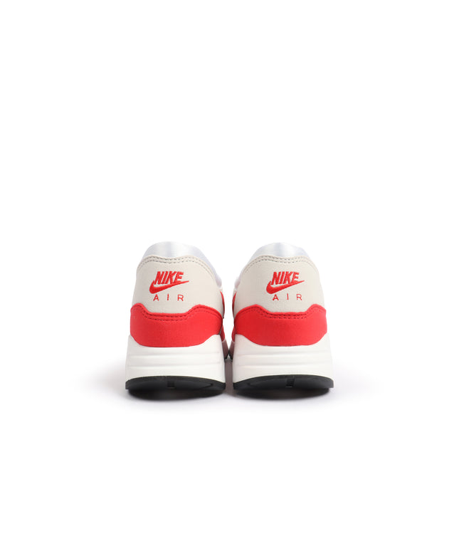 Rear view of Nike Womens Air Max 1 86 OG sneakers in white and university red, showing off-white uppers and red trim.