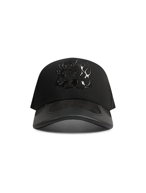 Piece Of Art black baseball hat featuring a glossy LA logo surrounded by flame graphics and a textured leather brim.