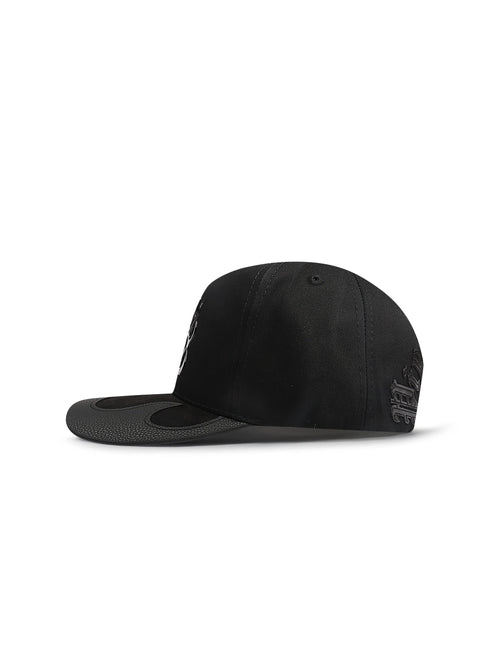 Side view of a black Piece Of Art Fire LA hat featuring a textured leather brim and dark embroidered side detailing.
