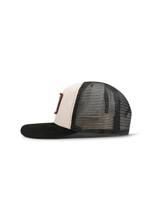 Drunk & Rich trucker hat featuring a black suede brim, cream suede front panel, and black mesh back with leather patch.