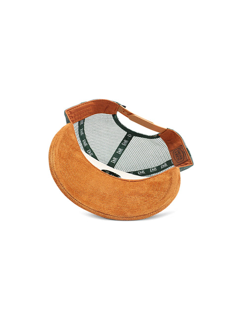 Drunk & Rich trucker hat featuring a brown suede brim, dark green mesh back, and an adjustable brown leather strap.