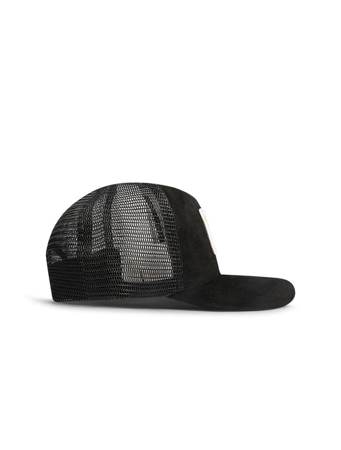Green cap with brown leather strap on a white background