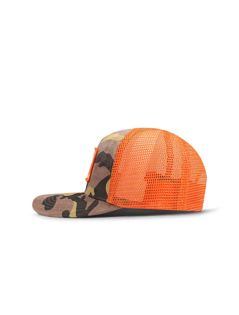 Drunk & Rich trucker hat with a camo suede front panel, orange mesh back, and curved visor, shown in side profile.