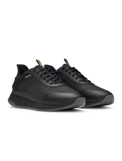 Boss Titanium Runn sneakers in sleek black featuring a mix of matte synthetic panels and breathable mesh fabric details.