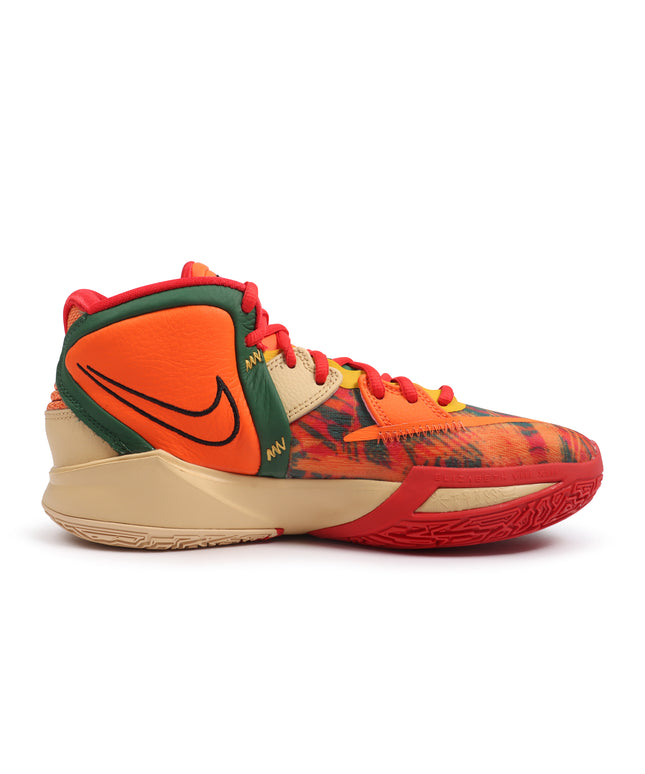 Nike Kyrie Infinity 1 World 1 People basketball shoe in orange, green, red, and tan with textured mesh and leather.