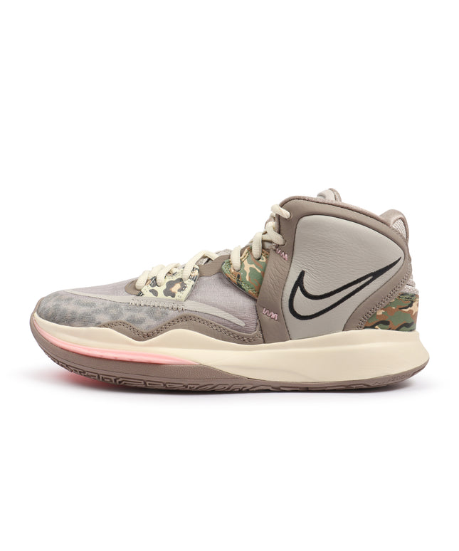 Nike Kyrie Infinity basketball shoe in tan and grey with leopard print, camouflage accents, and a pink midsole detail.