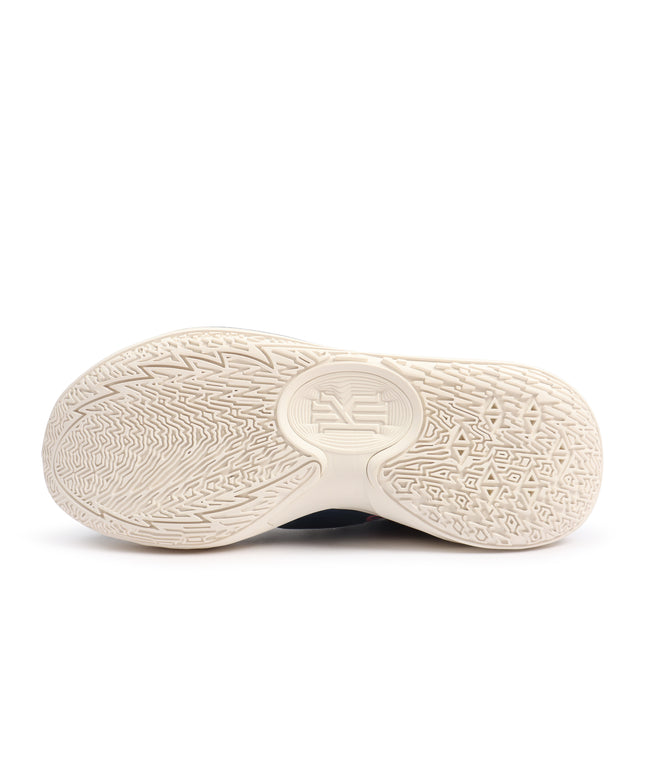 Bottom view of a Nike Kyrie 5 sneaker featuring a cream-colored textured rubber outsole with a geometric tread pattern.