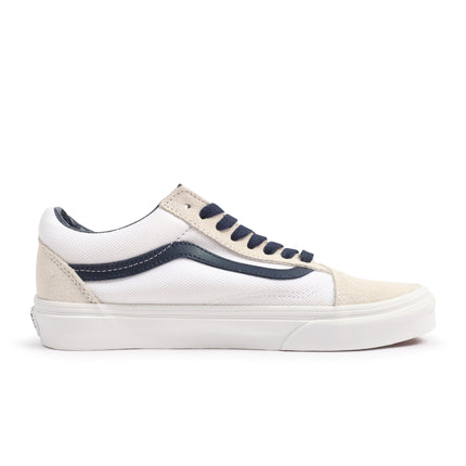 Vans Old Skool sneaker in white textile and beige suede, featuring a navy blue side stripe, matching laces, and sole.