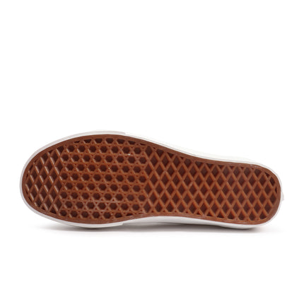 Bottom view of a Vans Old Skool sneaker featuring the signature gum rubber waffle-pattern outsole with white edging.