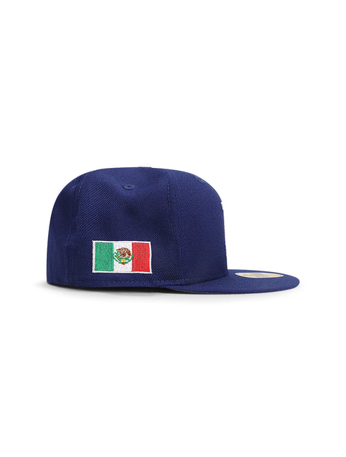 New Era 5950 LA Dodgers fitted hat in royal blue fabric, featuring an embroidered Mexican flag on the side panel.
