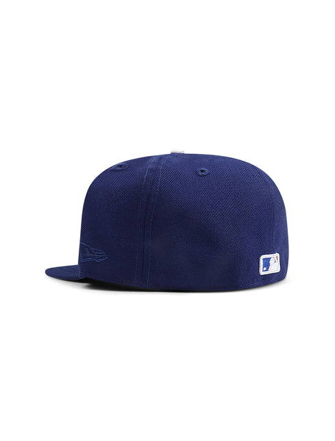 Royal blue New Era 5950 LA Dodgers fitted hat showing side profile, textured fabric, and MLB batterman logo patch.