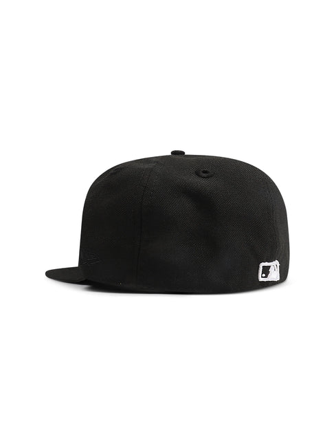 Side view of a black New Era 5950 LA Dodgers fitted hat in a textured fabric featuring the MLB logo on the back.