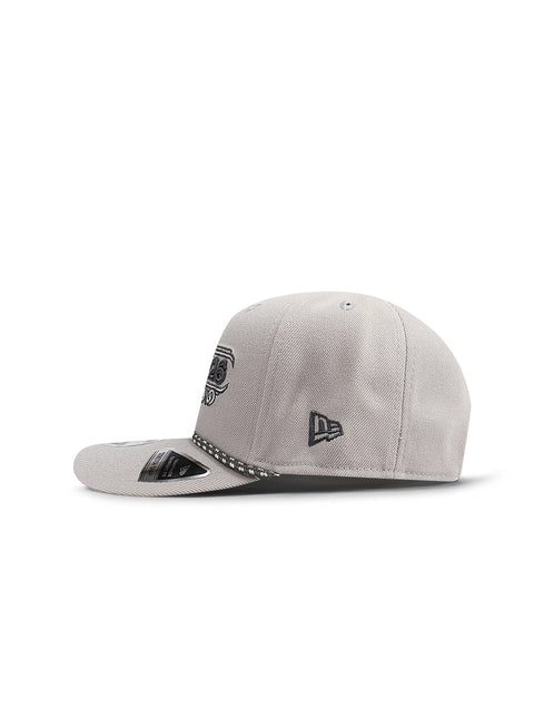 Side profile of a light gray baseball cap with a rope detail and a small logo on the side panel.