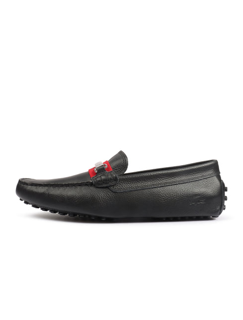 Black Lacoste leather loafer with a textured pebbled finish, featuring a red accent strap and a small silver buckle.