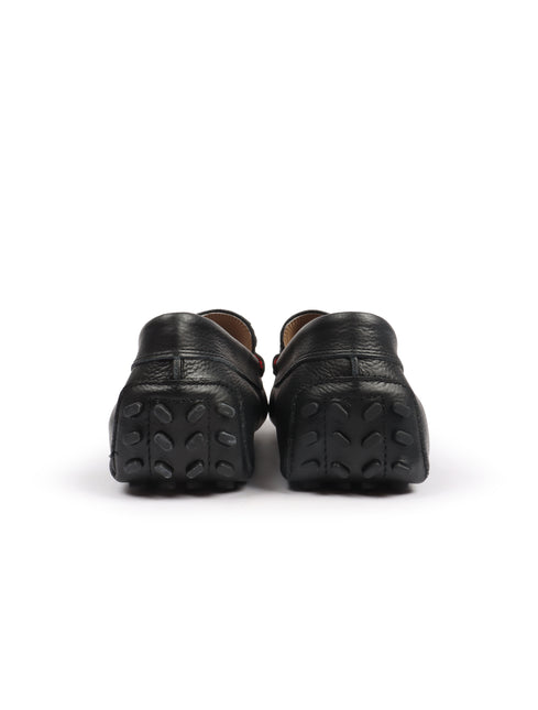 Back view of black Lacoste leather loafers for men featuring a textured grain finish and rubber pebbled outsoles.