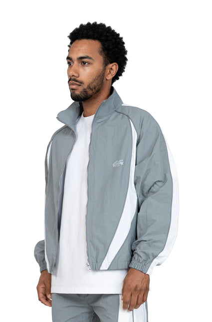 EPTM Legacy jacket in grey nylon with white side panel detailing, worn by a man over a plain white t-shirt.