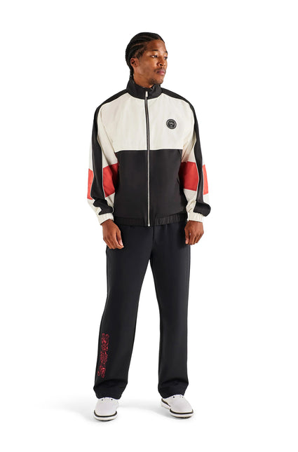 Malbon Axis jacket in cream and black featuring red side stripes, a high collar, and front zip in a sporty finish.