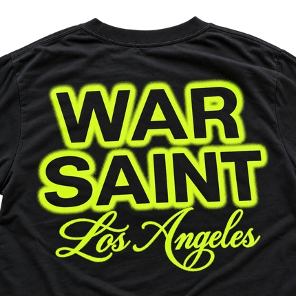 Black cotton Warsaint Halloween t-shirt featuring bold, neon green halftone text that reads WAR SAINT Los Angeles.